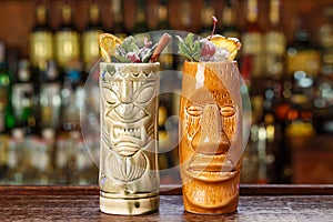 Refreshing cocktails on the bar in tiki glass