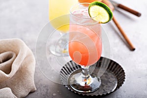 Refreshing cocktails or mocktails with oranges and cranberries