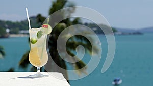 Refreshing coctail on the sea background