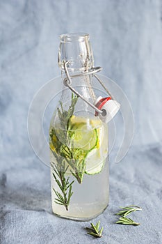 Refreshing detox drink. Cucumber, lemon, rosemary lemonade in a glass bottle