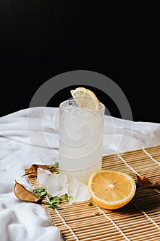 Refreshing drink or beverage homemade ice lemonade juice soda cocktail with fresh slice lemon and mint on white table