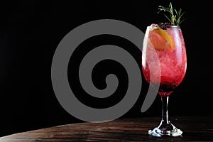 Refreshing drink with citrus fruits, tropical alcoholic beverage isolated on black background