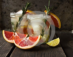 Refreshing drink grapefruit and rosemary lemonade . cold beverage