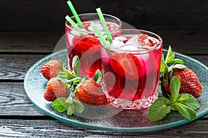 Refreshing drink with strawberries and ice
