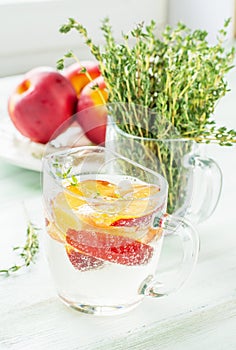 Refreshing fizzy drink with slices of peach