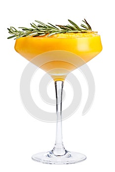 Refreshing fruit cocktail. A refreshing drink with a mango pulp, decorated with rosemary.