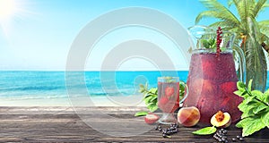 Refreshing fruit juice on the tropical beach, summer background