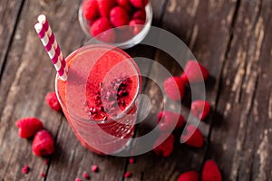 Refreshing fruit smoothie elegantly decorated with raspberries