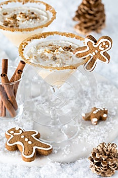 Refreshing gingerbread martinis with whip cream and cookie crumbs.