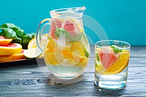 Refreshing healthy homemade citrus lemonade served in glass pitc photo