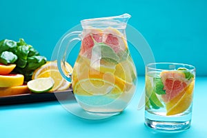 Refreshing healthy homemade citrus lemonade served in glass pitc photo