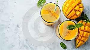 Refreshing and healthy mango smoothie in tall glasses