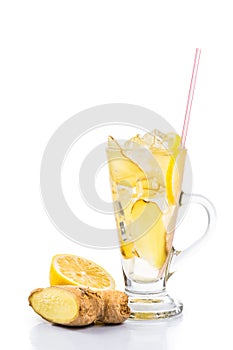 Refreshing ice cold ginger lemon tea in transparent glass on vertical format