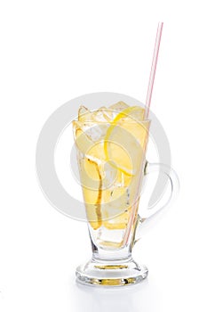 Refreshing ice cold ginger lemon tea in transparent glass on vertical orientation