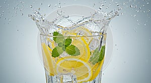 Refreshing Lemon and Mint Drink Splash in Glass