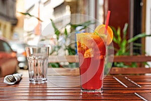 Refreshing lemonade on wooden table