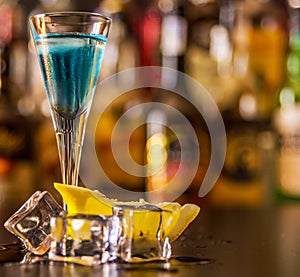 Refreshing liqueur in a tall glass, alcoholic drink prepared by