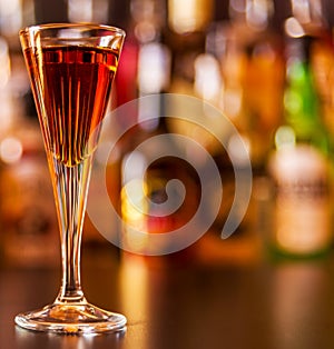 Refreshing liqueur in a tall glass, alcoholic drink prepared by