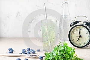 Refreshing morning drink with basil seeds. Light photography with copy space