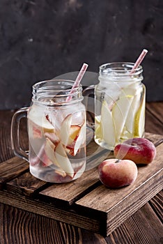 Refreshing peach drink Cold pear drink Infused water Cold fruit lemonade Rustic Drink for fasting day Vertical photo