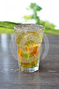 Refreshing peach and mint ice tea served outdoors