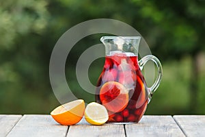 Refreshing sangria or punch with fruits in pincher