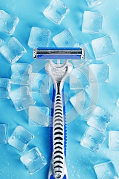 Refreshing shaving machine on the background of frosty ice cubes without irritation