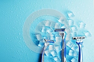 Refreshing shaving machines for the face against the background of frosty ice cubes