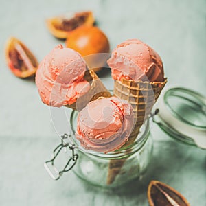 Refreshing summer blood orange ice cream and fruits, square crop