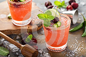 Refreshing summer cocktail with cherry