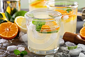 Refreshing summer cocktail with citrus fruits