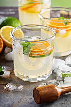 Refreshing summer cocktail with citrus fruits