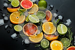 Refreshing summer  cocktail  with crushed  and citrus fruits on the dark background