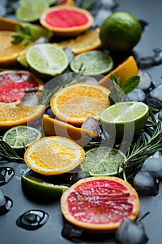 Refreshing summer  cocktail  with crushed  and citrus fruits on the dark background