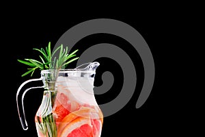 Refreshing summer detox cocktail of grapefruit and rosemary, on white background,