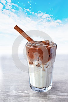 Refreshing summer drink concept a glass of Ice cocoa with sky background