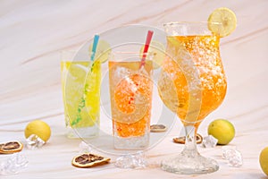 Refreshing summer drinks with alcohol on table background and cool drinks with lemonade