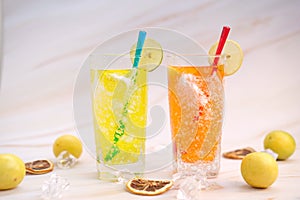 Refreshing summer drinks with alcohol on table background and cool drinks with lemonade