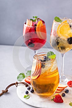 Refreshing summer sangria with berries and fruits with red and white wine