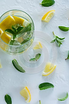 Refreshment ice drink/cocktail with lemons and mint photo