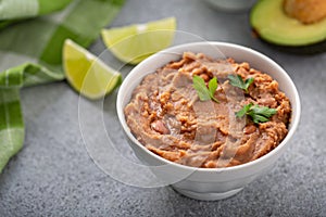 Refried beans in a white bowl