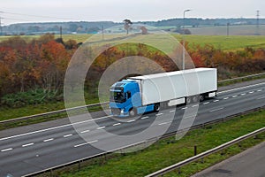 Refrigerated lorry in motion on the road photo