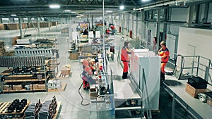 Refrigeration factory with female employees assembling fridges