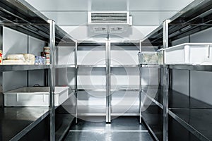 Refrigerator chamber with steel shelves in a restaurant