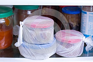 Refrigerator with frozen food meat, milk, vegetables. Ready meal