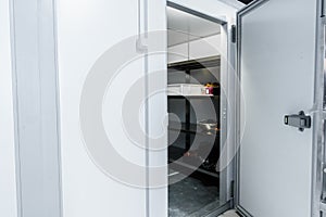 Refrigerator room door in professional kitchen in restaurant