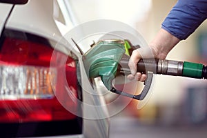 Refuel the car at a gas station fuel pump