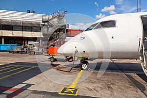 Refueling the aircraft. Tanking small airplane outdoors. Transportation concept