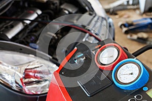 Refueling of car conditioner in auto repair shop