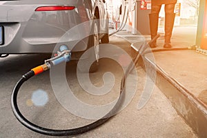 Refueling car. Pump gas at petrol fuel station. Gasoline oil nozzle tank from hand person. Automotive industry or